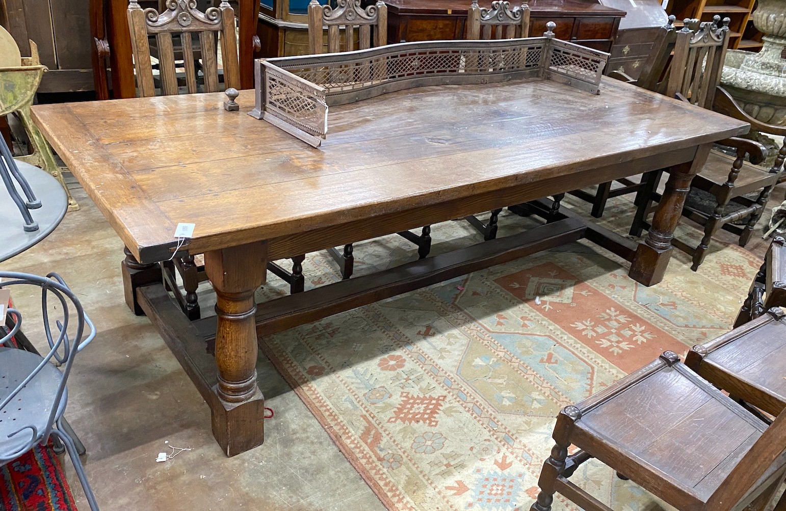 An 18th century style rectangular oak refectory dining table, length 259cm, width 101cm, height 76cm